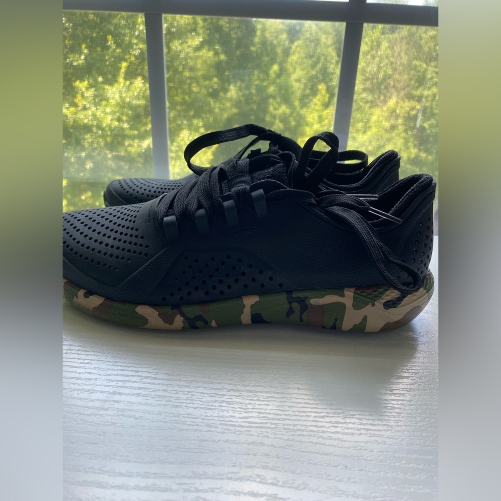 never worn before, black and camo athletic shoes.
